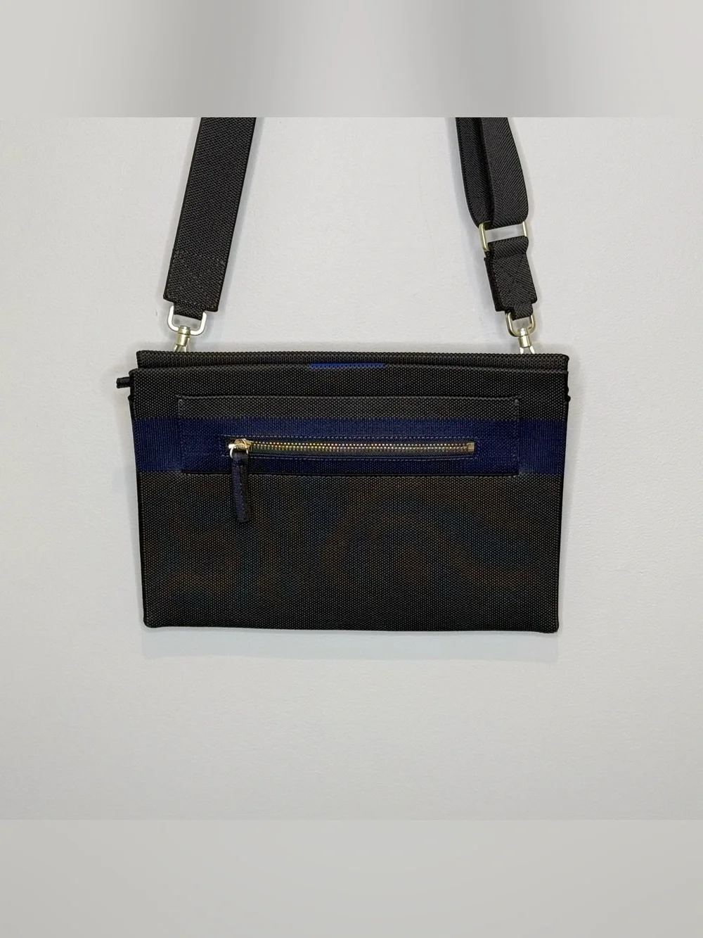 Rothy’s dark gray and blue fabric crossbody clutch or shoulder bag